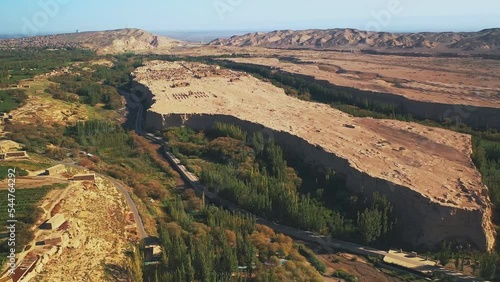 Aerial view of a ruined desert city. Archaeological Historic Site of the UNESCO World Heritage Site. Ancient Silk Road City at Jiaohe Ruins in Turpan, Xinjiang Uygur Autonomous Region, China. photo