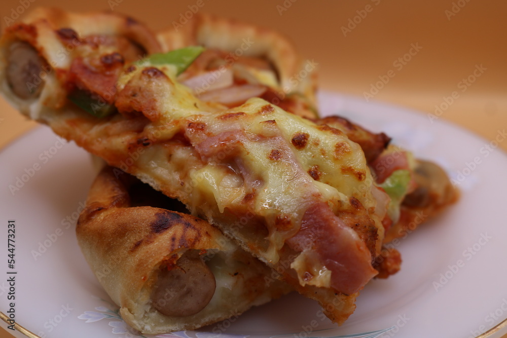 piece of pizza with ham and cheese piece of pizza with ham and cheese