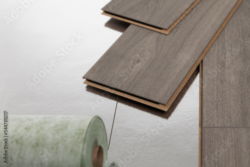Photos Installation of floating floor, underlay with sheets of laminate