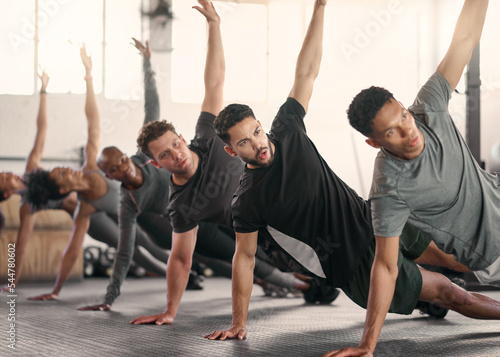 Fototapeta Naklejka Na Ścianę i Meble -  Teamwork, fitness or sport team stretching in gym, studio or arena floor for wellness, exercise or sports workout. Diversity, health or athlete group for warm up, motivation or cardio team building