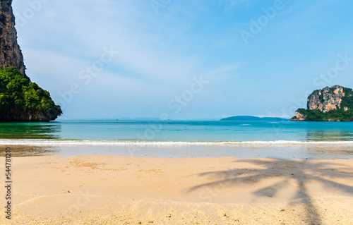 Landscape of sea beach sand and blue sky with sunny in nice weather day at Railay Krabi sea Thailand.