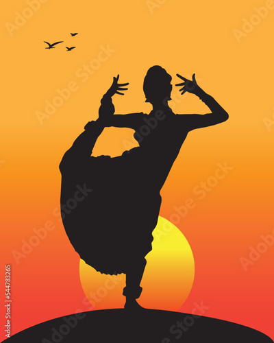Bharatanatyam, south Indian classical dance by woman. Beautiful girl dancing with sunset background. photo