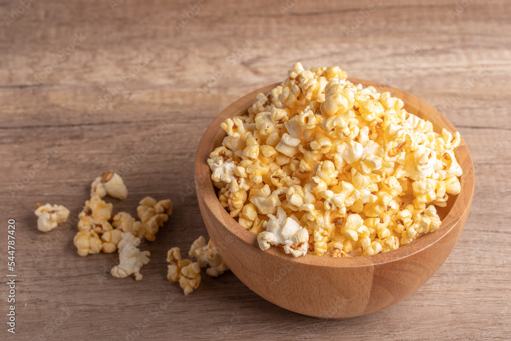 Popcorn in a wooden cup. Snacks. Popcorn in a wooden cup. Snacks.