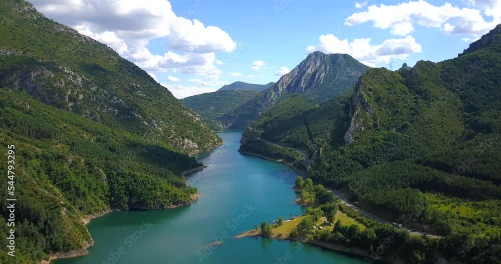 Paradise on earth showing beautiful blue water lake amidst green mountains. Aerial. Spain. Paradise on earth showing beautiful blue water lake amidst green mountains. Aerial. Spain.