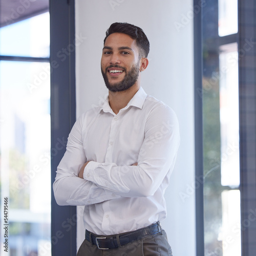 Confident businessman, portrait smile and arms crossed with vision, ambition or mission for success at the office. Happy man smiling in management for business objects, tasks or company goals at work