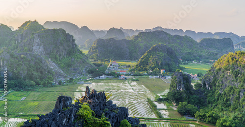 Aerial panorama sunset view of landscapes and lotus fields in Ninh Binh, Vietnam photo