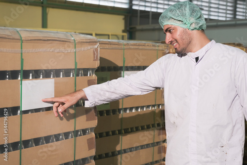 Asian man factory worker or expert staff is checking stock in store