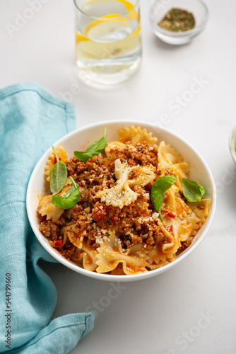 Tasty pasta with meat sauce and cheese bolognese in bowl food