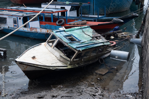 Wallpaper Mural selective focus on fishing boats that sank on the beach, damaged ships became trash at sea Torontodigital.ca