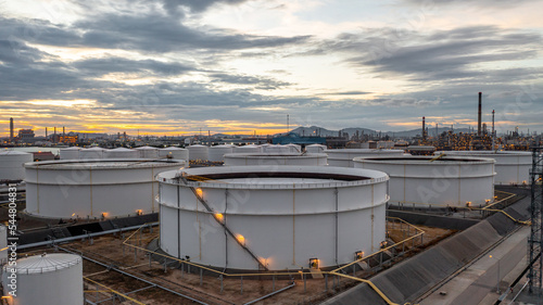 Slika na platnu Crude oil storage tank terminal port, Oil terminal pipeline fuel storage tank at oil refinery industrial zone in the cargo seaport and ship tanker and storage silo tank at petrochemical terminal port