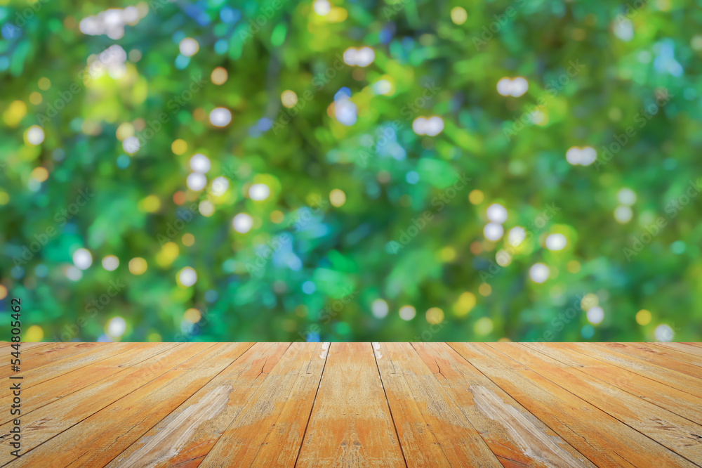 Empty wood table top with blur Christmas tree with bokeh light background