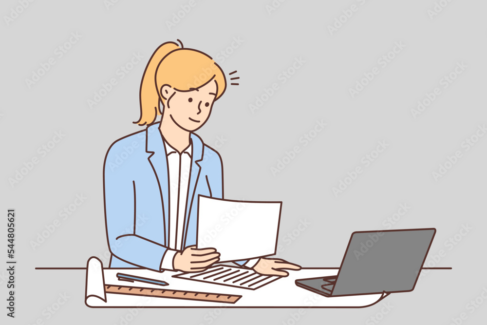 Female architect work on computer in office Female architect work on computer in office