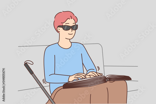 Blind man read braille book 