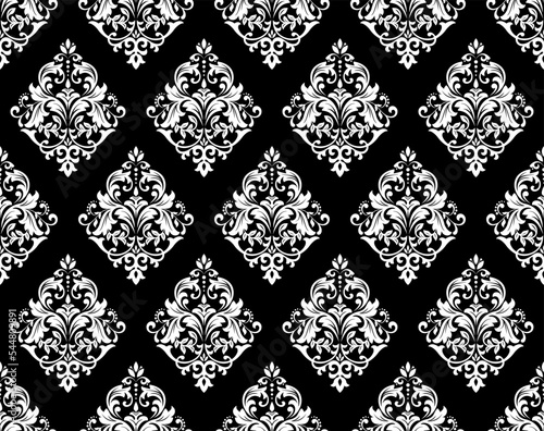 Wallpaper in the style of Baroque. Seamless vector background. White and black floral ornament. Graphic pattern for fabric, wallpaper, packaging. Ornate Damask flower ornament