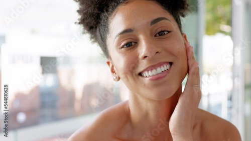Beauty, skincare and happy woman touching her face for a wellness, health and skin routine. Happiness, smile and portrait of lady from Brazil doing a cosmetic facial treatment in her bathroom at home