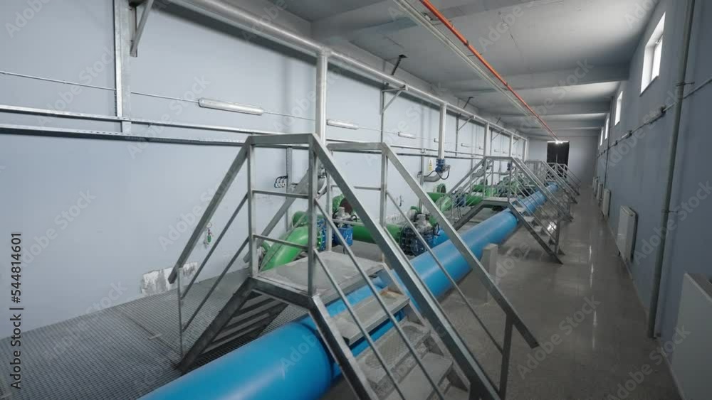 big blue and green pipes in factory corridors big blue and green pipes in factory corridors