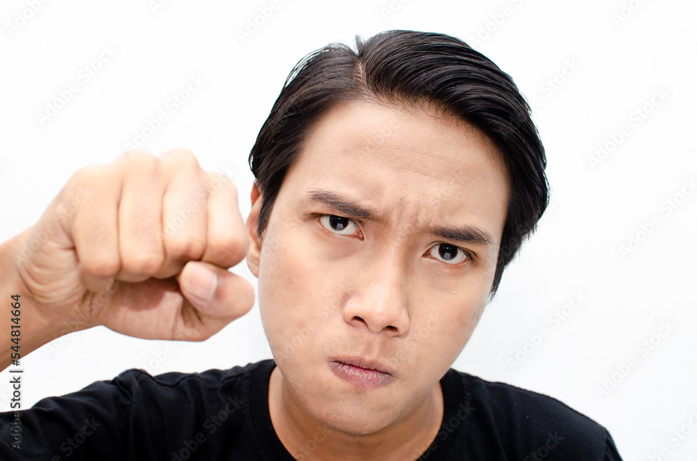 Headshot of asian man with angry, mad, depressive and furious face expression looking for fight isolated over white Headshot of asian man with angry, mad, depressive and furious face expression looking for fight isolated over white