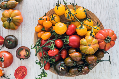 colorful tomatoes on the wooden table