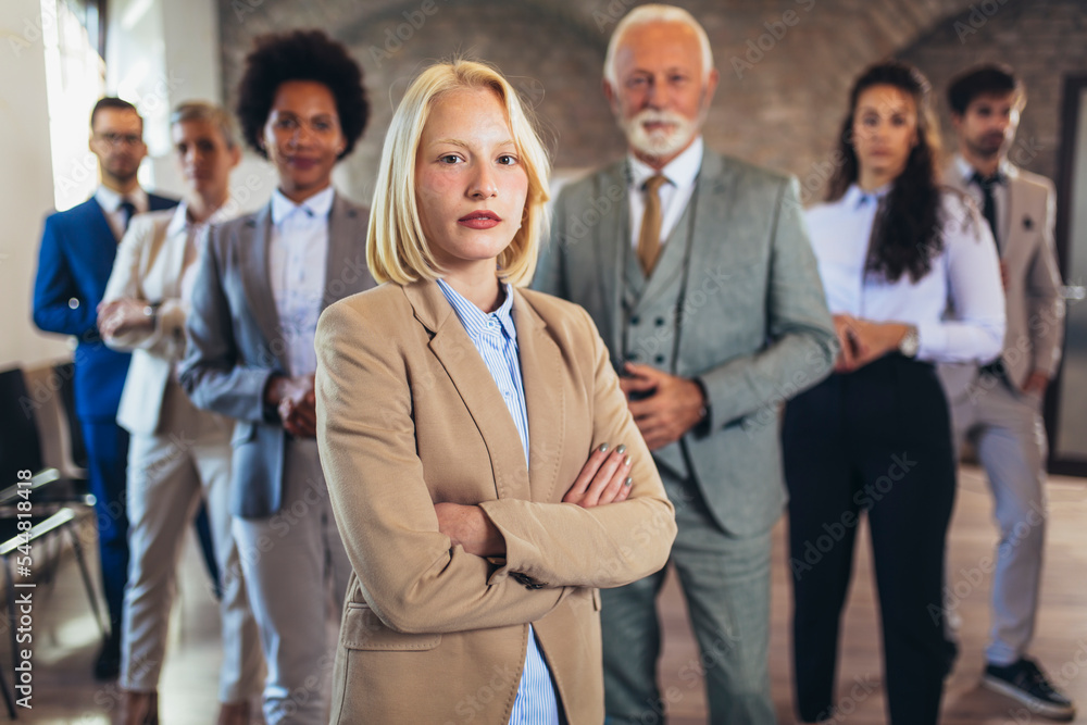 Group of business people with businesswoman leader on foreground Group of business people with businesswoman leader on foreground