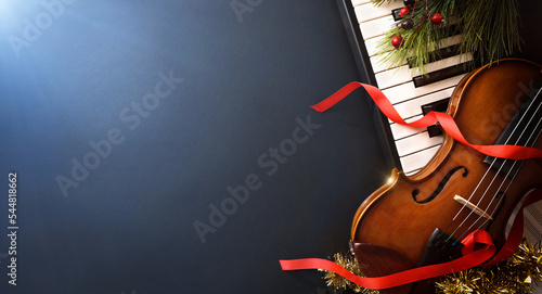 Obraz na płótnie Christmas musical event with piano and violin and blue light