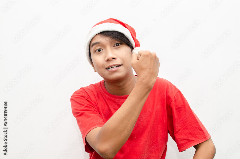 expressive happy confident young asian man in christmas santa theme clothes with shocked, surprised and amazed face expression. christmas model concept for sale and discount. expressive happy confident young asian man in christmas santa theme clothes with shocked, surprised and amazed face expression. christmas model concept for sale and discount.