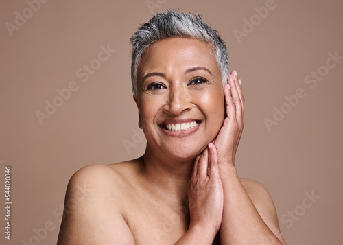 Senior woman, beauty and studio portrait for skincare, healthy glow and face cosmetics promotion on marketing mock up or copy space. Old woman model from India with night time skin care facial shine