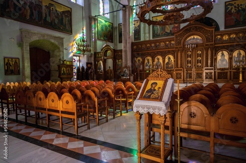 Nice wooden armchair in main nave with altare in church of Agios Titos, Heraklion. photo