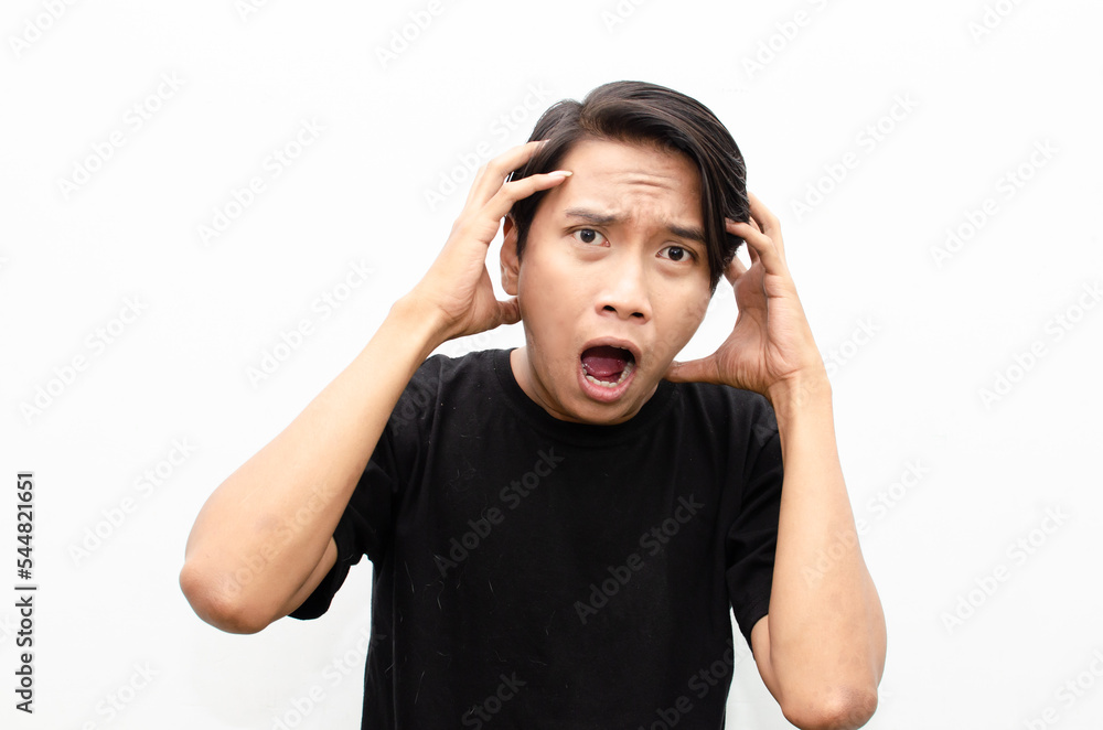 Headshot of asian man with angry, mad, depressive and furious face expression looking for fight isolated over white Headshot of asian man with angry, mad, depressive and furious face expression looking for fight isolated over white