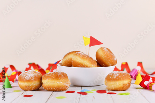 German traditional 'Berliner Pfannkuchen', a donut without hole filled with jam. Traditional served during carnival.