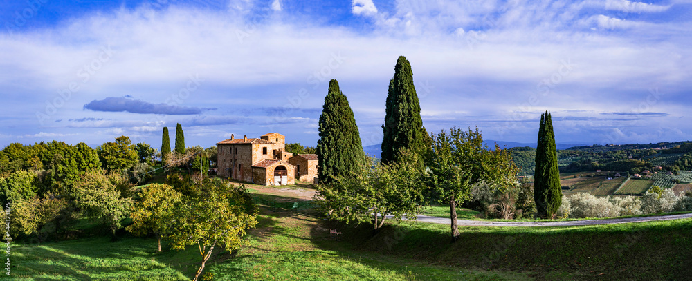 Romantic scenic Tuscany countryside. Typical scenery with cypresses. Montalcino town.  Italy, Toscana landscape