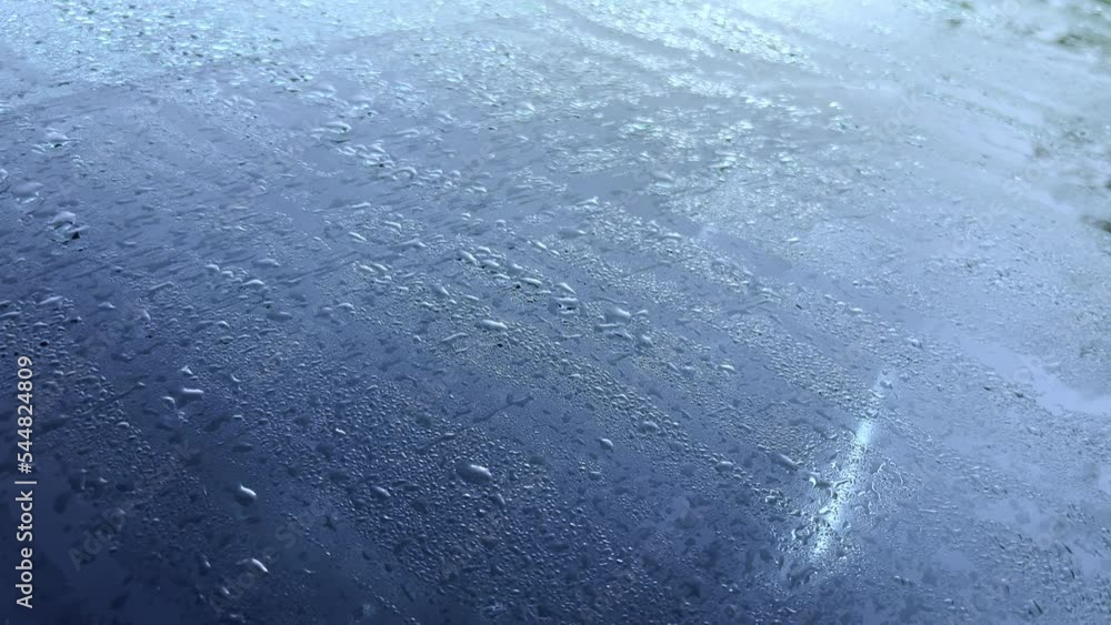Drops of water on the windshield of a car. Melted frost in the morning on the car. Drops of water on the windshield of a car. Melted frost in the morning on the car.