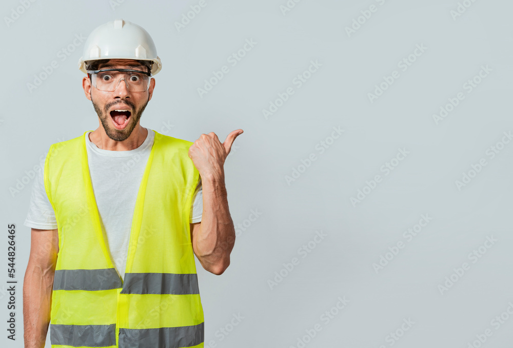 Surprised face construction worker pointing at an advertisement. Engineer man pointing to side. Surprised face engineer pointing finger to the right, Surprised engineer pointing to the side Surprised face construction worker pointing at an advertisement. Engineer man pointing to side. Surprised face engineer pointing finger to the right, Surprised engineer pointing to the side