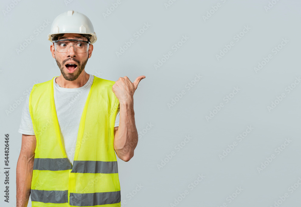 Surprised engineer pointing to the side. Surprised face construction worker pointing at an advertisement. Engineer man pointing to side. Surprised face engineer pointing finger to the right Surprised engineer pointing to the side. Surprised face construction worker pointing at an advertisement. Engineer man pointing to side. Surprised face engineer pointing finger to the right