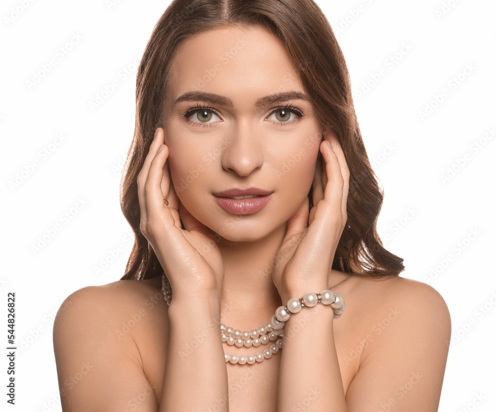 Young woman with elegant pearl jewelry on white background Young woman with elegant pearl jewelry on white background