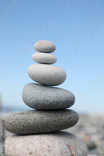 Stack of stones on beach against blurred background  closeup