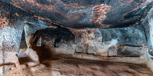 interior of a house carved into the rock in Zelve photo