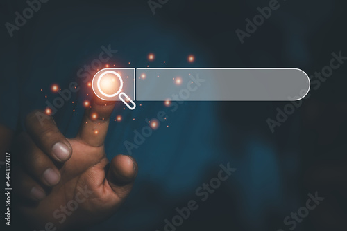 Hand man using moblie phone for Searching browsing data on the Internet online.network,media, keyword,Digital Web,Photo concept Searching information of and Technology.