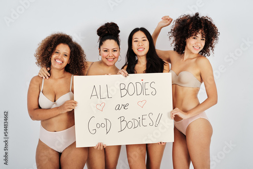 Happy multiracial women with motivational banner