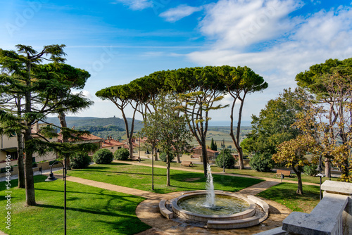 Panorama from the main square of the village towards the plain and the sea from Castagneto Carducci Tuscany Italy