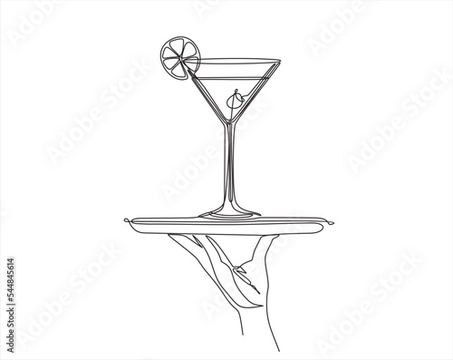 Continuous line vector illustration of hand holding dish with glass with martini drawn from the hand a picture of the silhouette. Line art. 