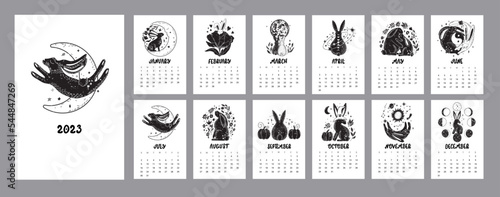 Cute calendar 2023 with rabbits, astrological, esoteric elements. Moon, stars. Black bunny symbol.