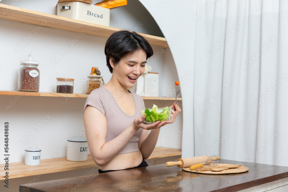 Portrait of a happy playful girl eating fresh salad from a bowl. Portrait of a happy playful girl eating fresh salad from a bowl.