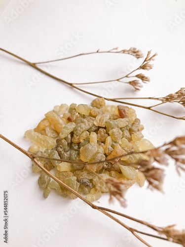 Set of natural resins and twigs of dried flowers , frankincense on white background
