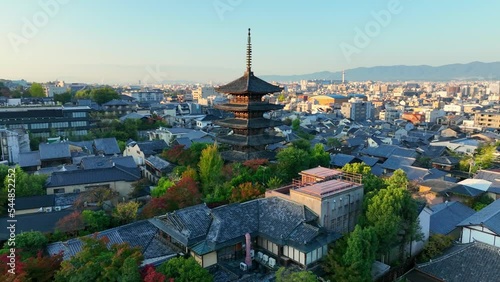 Kyoto at sunrise, aerial view of downtown Kyoto with historic Yasaka pagoda, cultural centre of Japan, flying around famous shrine of Yasaka pagoda