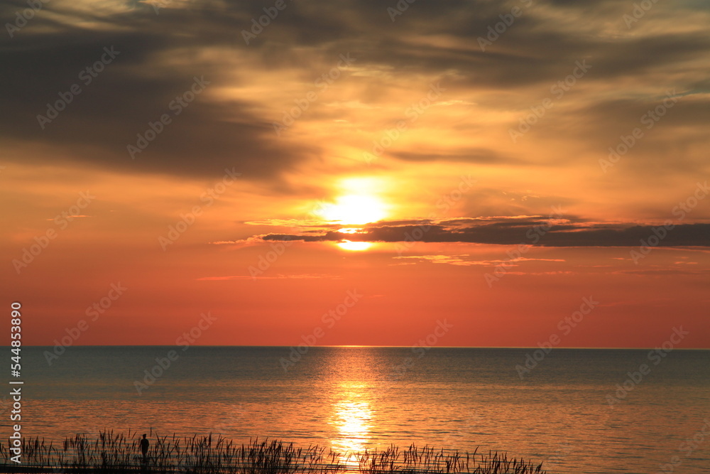 Reflection of the setting sun in the sea. Selective focus