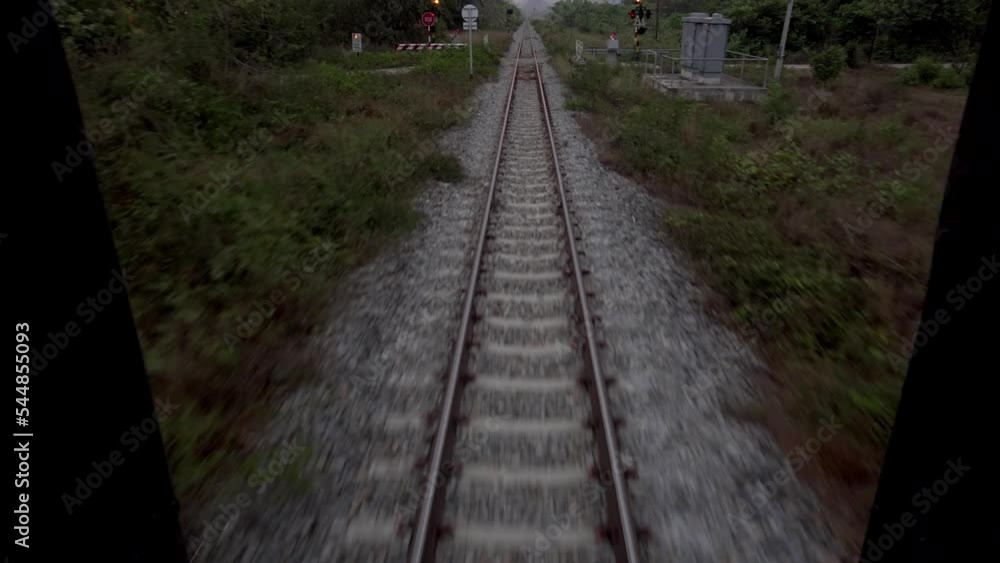 Traveling Thailand by train. View from a moving car on the rails. Traveling Thailand by train. View from a moving car on the rails.