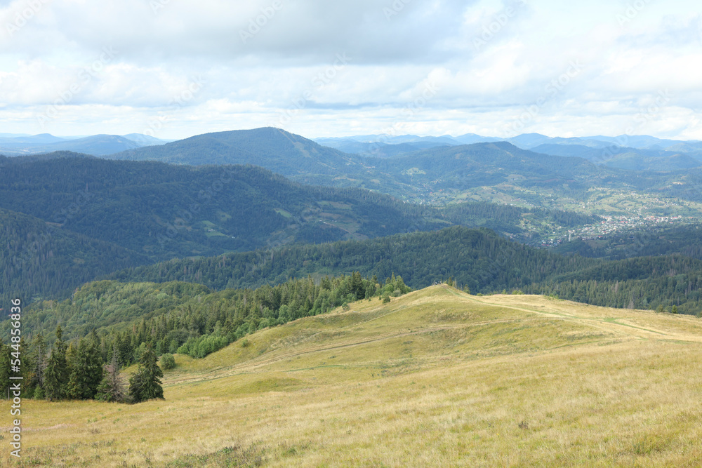 Picturesque view of mountain landscape and cloudy sky Picturesque view of mountain landscape and cloudy sky