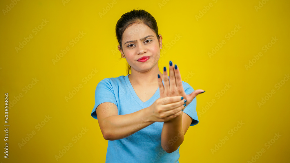 Young woman suffering pain on hands and fingers, arthritis inflammation Young woman suffering pain on hands and fingers, arthritis inflammation