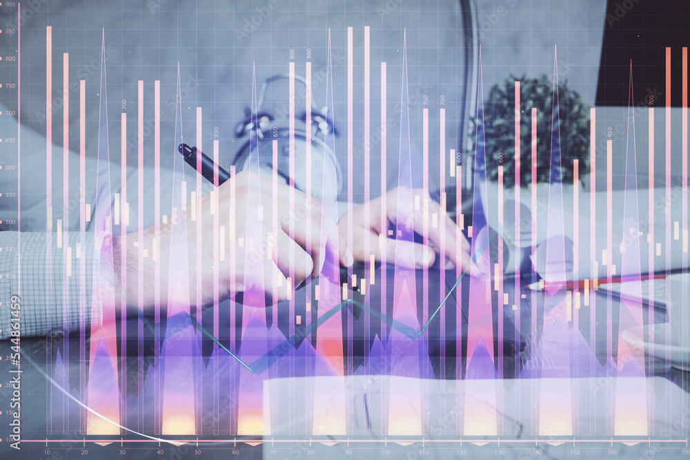 Double exposure of man's hands holding and using a phone and financial graph drawing. Analysis concept. Double exposure of man's hands holding and using a phone and financial graph drawing. Analysis concept.