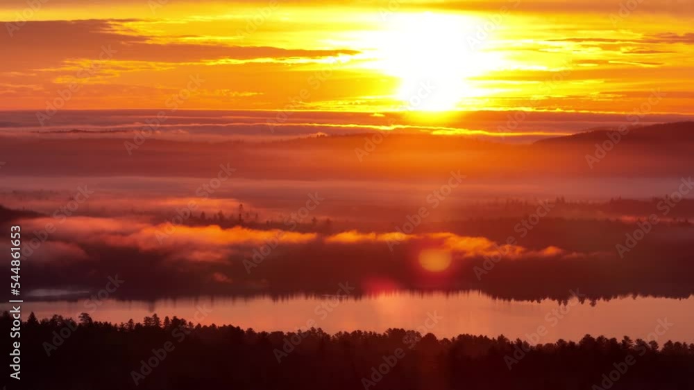 Aerial Flight of wilderness lake view illuminated by golden hour sunset Aerial Flight of wilderness lake view illuminated by golden hour sunset